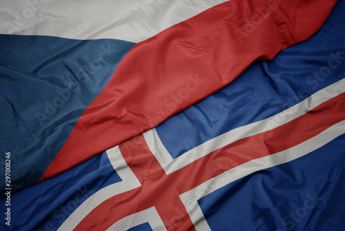 waving colorful flag of iceland and national flag of czech republic.