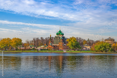 The autumn sunny day. Moscow, cityscape with a view of the Ostankino pond and the Church of the Life-Giving Trinity( 17 centurity) in Ostankino district.