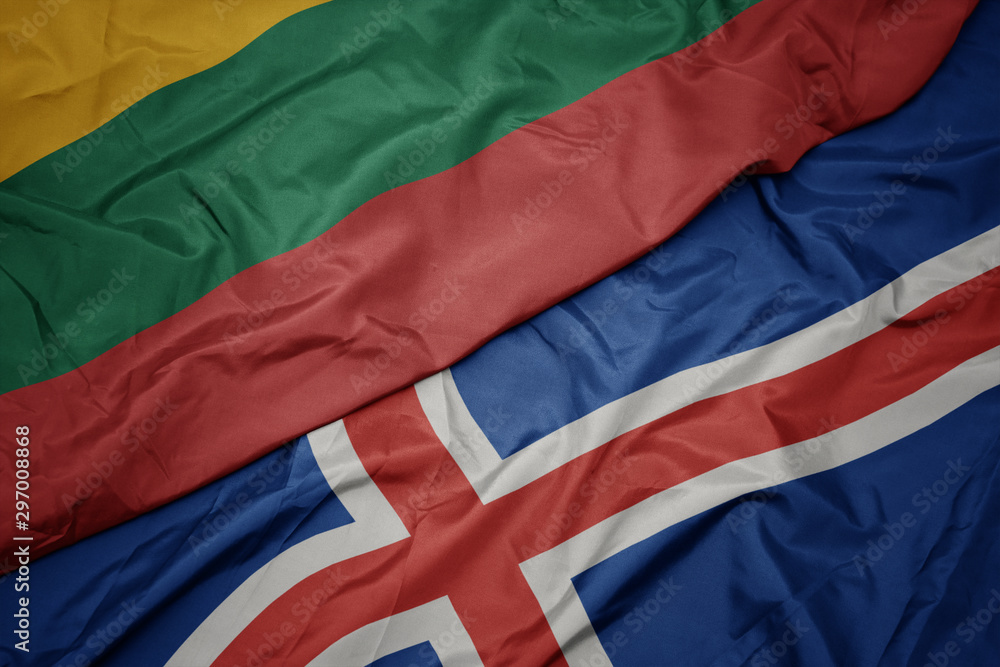 waving colorful flag of iceland and national flag of lithuania.