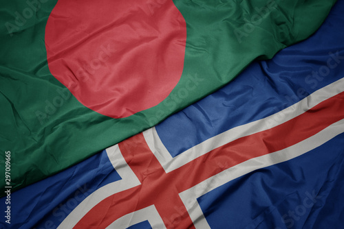 waving colorful flag of iceland and national flag of bangladesh.