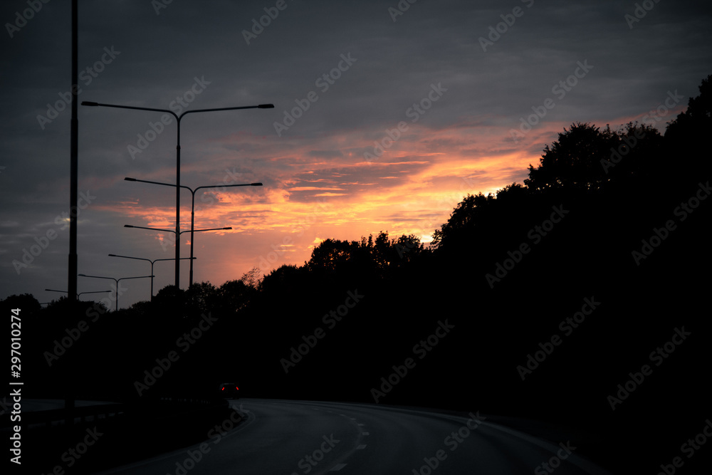 Sunset over silhouettes of trees Sunset over silhouettes of trees