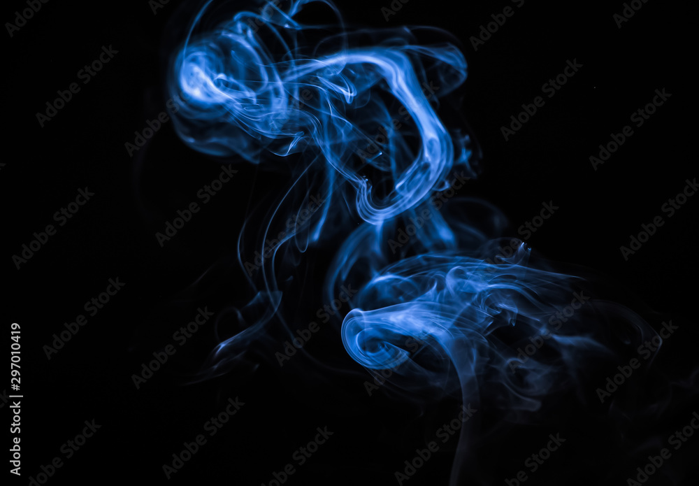 Colored blue smoke on a black background Colored blue smoke on a black background