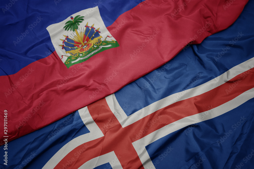 waving colorful flag of iceland and national flag of haiti.