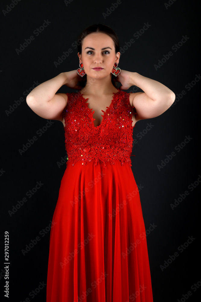 Sensual beautiful blonde woman posing in red dress. Sensual beautiful blonde woman posing in red dress.
