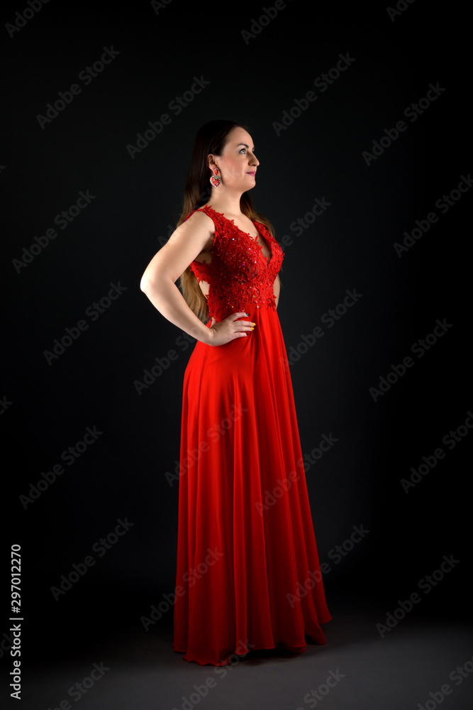 Sensual beautiful blonde woman posing in red dress. Sensual beautiful blonde woman posing in red dress.