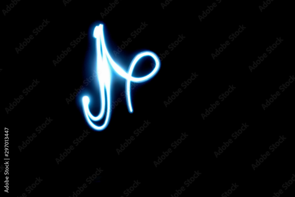 Freezelight, drawing with light. The figure of white light rays on a black background. Freezelight, drawing with light. The figure of white light rays on a black background.