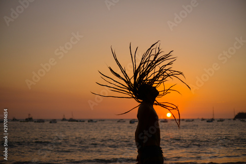 dreadlock young man in sunset photo