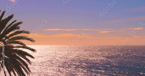 Evening sunset sky over sea calm surface, clear peaceful water texture, open horizon line panoramic natural real time, silhouetted susnet magic, romantic video background, empty Hawaii Maui Pacific 4K
