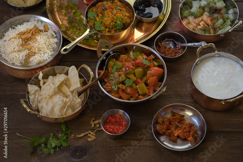 Vegetarian Indian meal served in traditional copper bowls