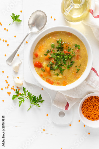 Vegetarian vegetable lentil soup with fresh parsley, healthy eating, top view