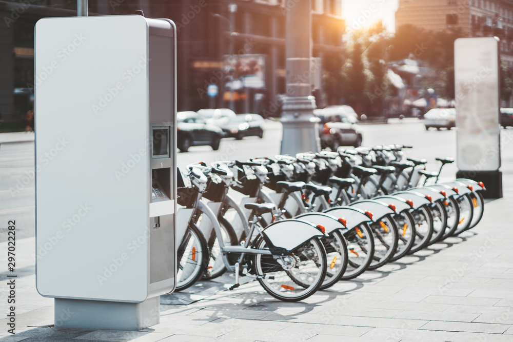 Ταπετσαρία Modern rental electric bikes standing a row during charging on a bright day with