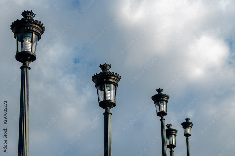 old street lamps on blue sky
