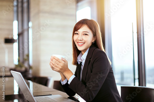 young business woman working in office