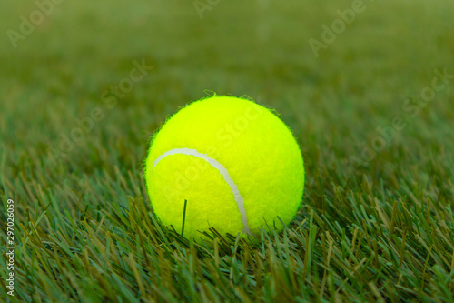 Yellow tennis ball on artificial turf