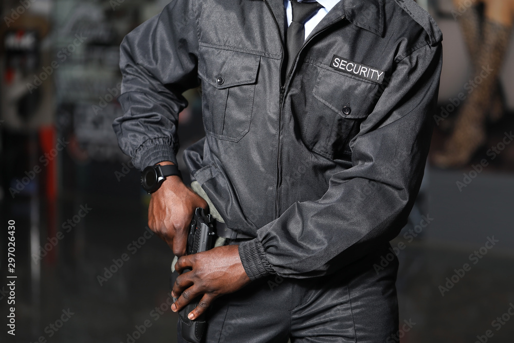 African-American security guard working in building