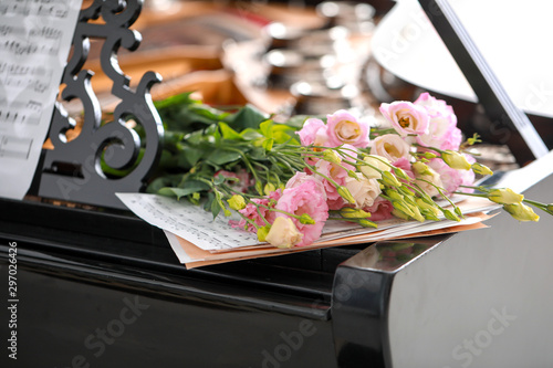 Bouquet of beautiful flowers on grand piano