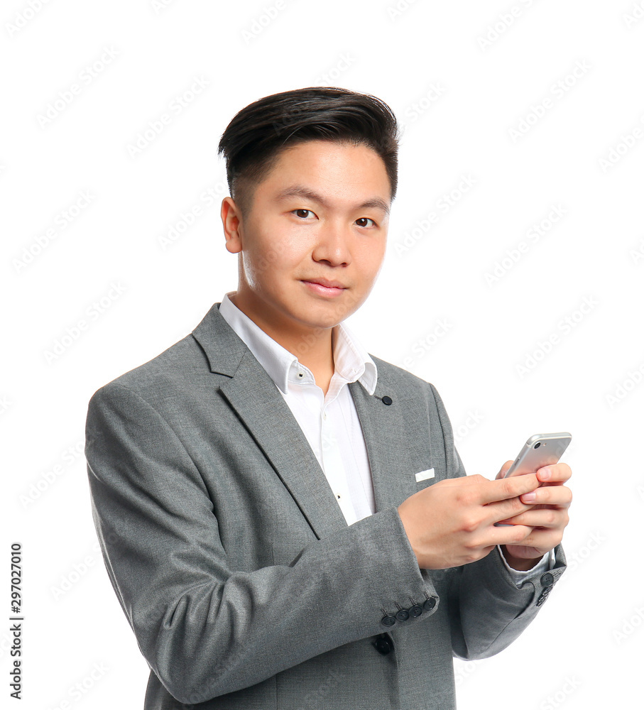 Portrait of Asian businessman with mobile phone on white background Portrait of Asian businessman with mobile phone on white background