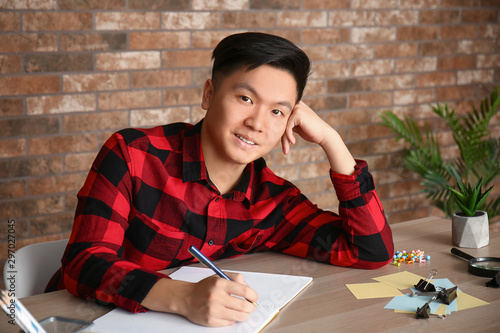 Asian student preparing for...