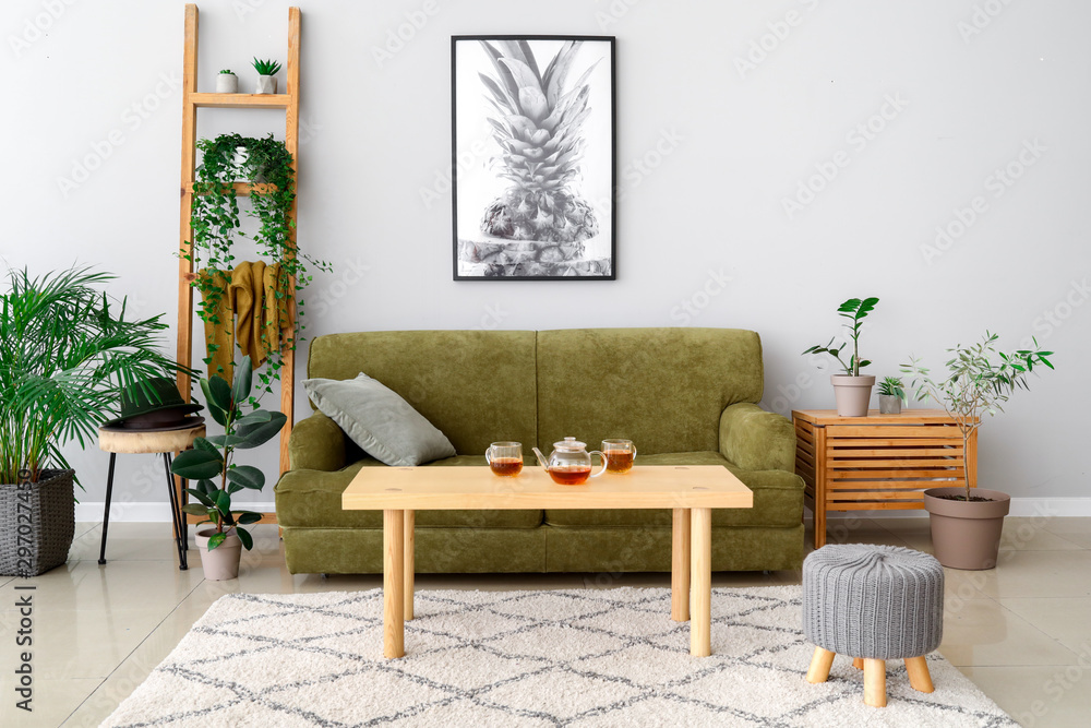Stylish interior of room with green houseplants - obrazy, fototapety, plakaty 