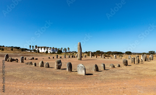 Xarez stone circle (Cromeleque do Xerez), a standing stone quadrant near Monsaraz, Portugal with Convento da Orada in background photo