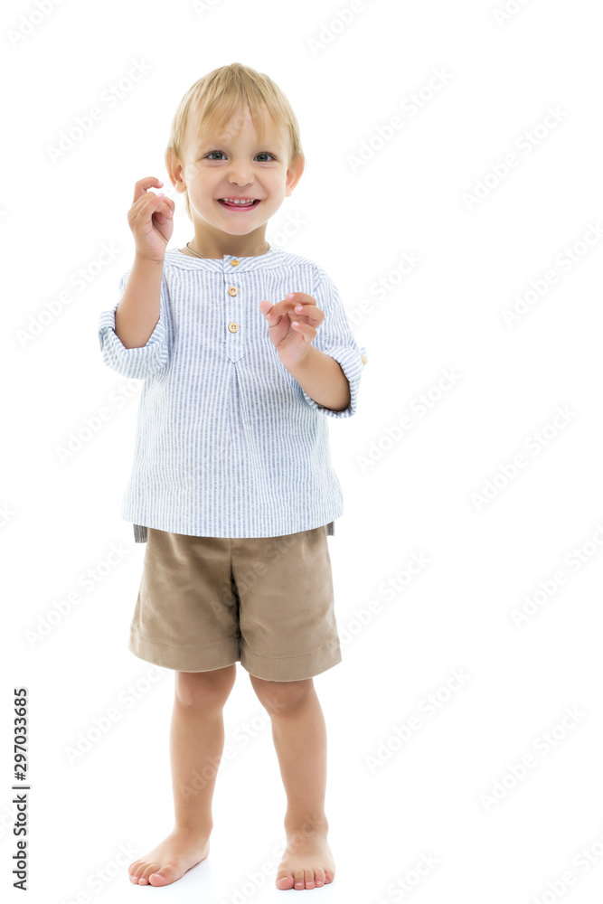 The little boy is emotionally waving his arms. The little boy is emotionally waving his arms.