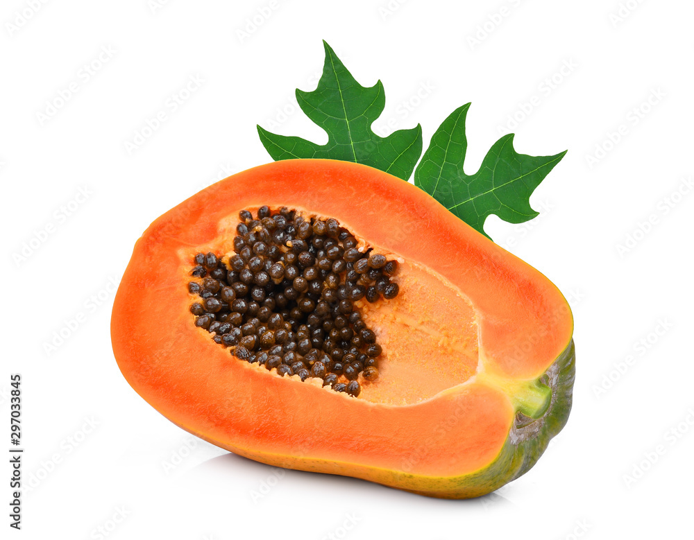 half cut of ripe papaya with leaf isolated on white background half cut of ripe papaya with leaf isolated on white background