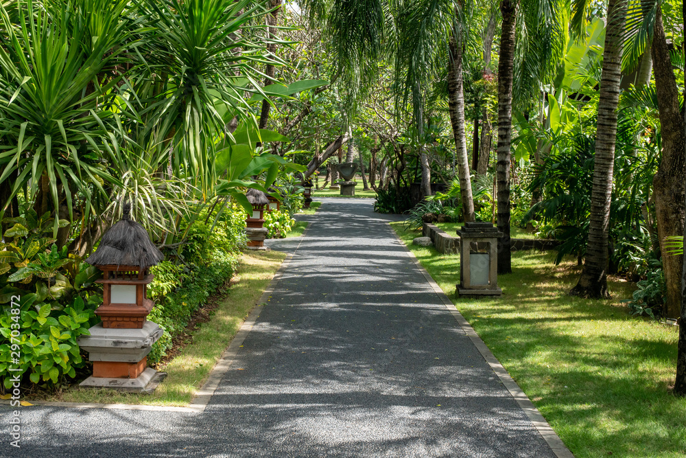 Pathway through the landscaped gardens of a tropical resort in Bali Indonesia