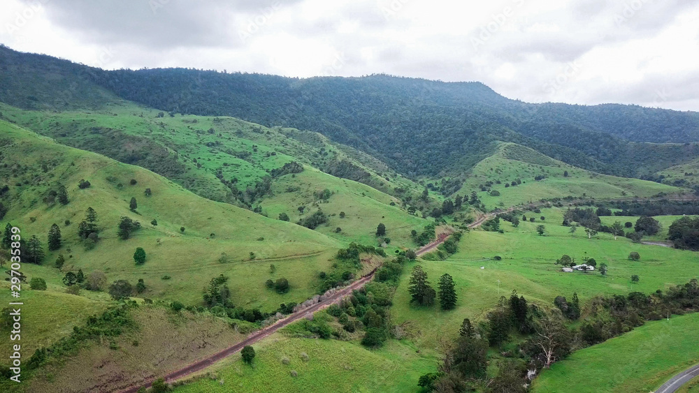 Aerial Drone Above Lush Green Rural Landscape On A Overcast Day