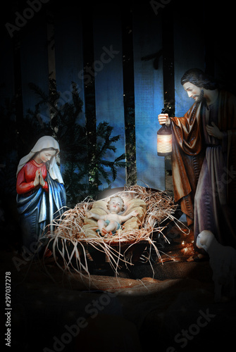 Nativity scene with Joseph, Mary, and the Baby Jesus in a manger.