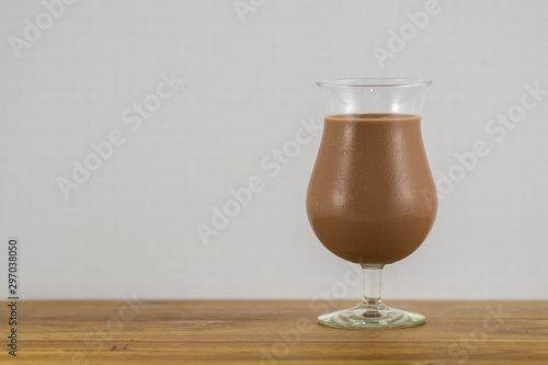 Delicious Creamy Chocolate Milkshake On Timber Board With White Background In A Studio