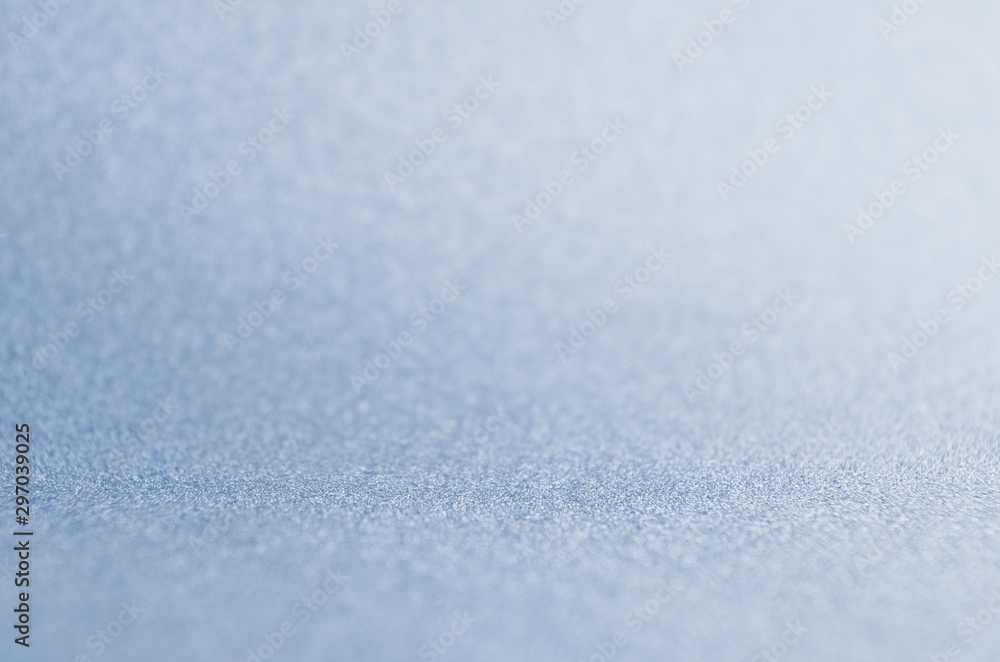 Obraz premium Light blue winter shine glittering bokeh background for New Year and Christmas background.