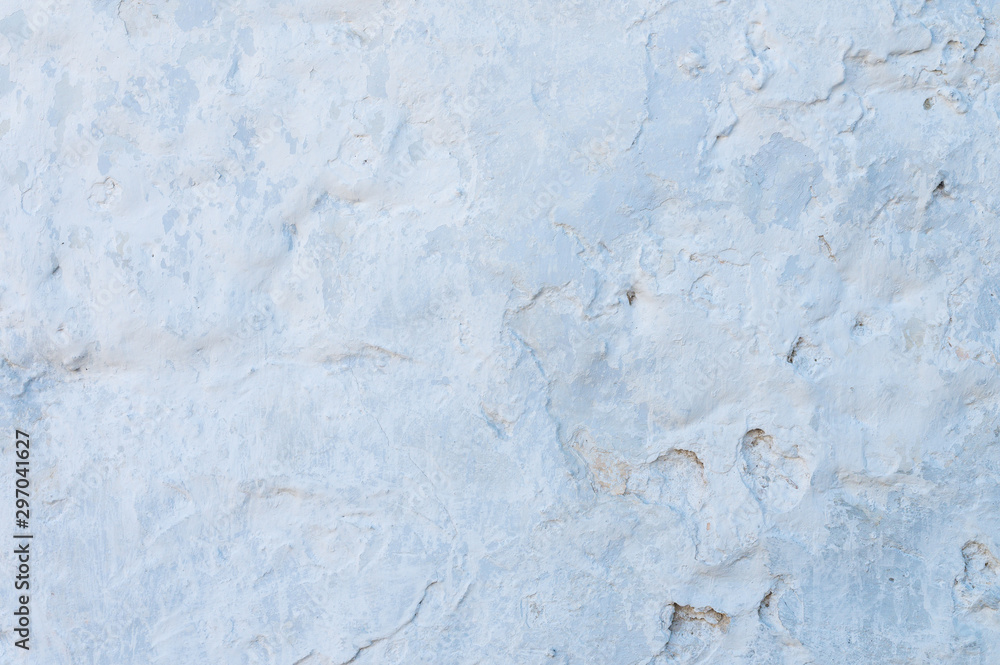 Blue plastered repeatedly brick wall texture. Whitewash Brick wall facade building surface. White wash abstract background Blue plastered repeatedly brick wall texture. Whitewash Brick wall facade building surface. White wash abstract background