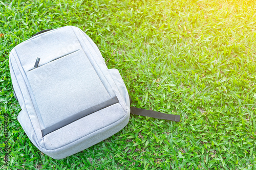 Gray backpack placed on the lawn