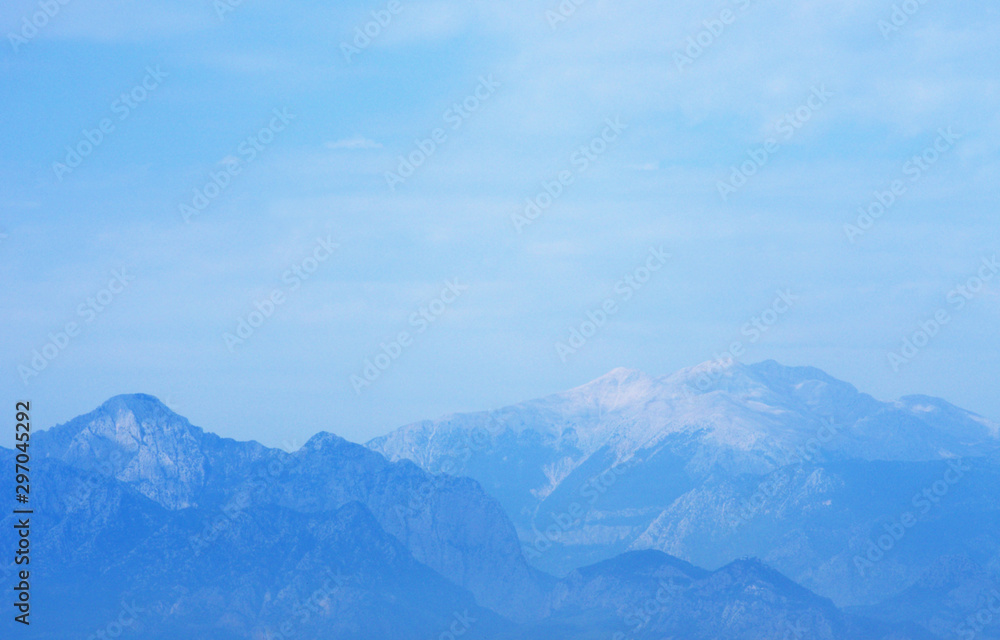 mountains against the blue sky. mountains against the blue sky.