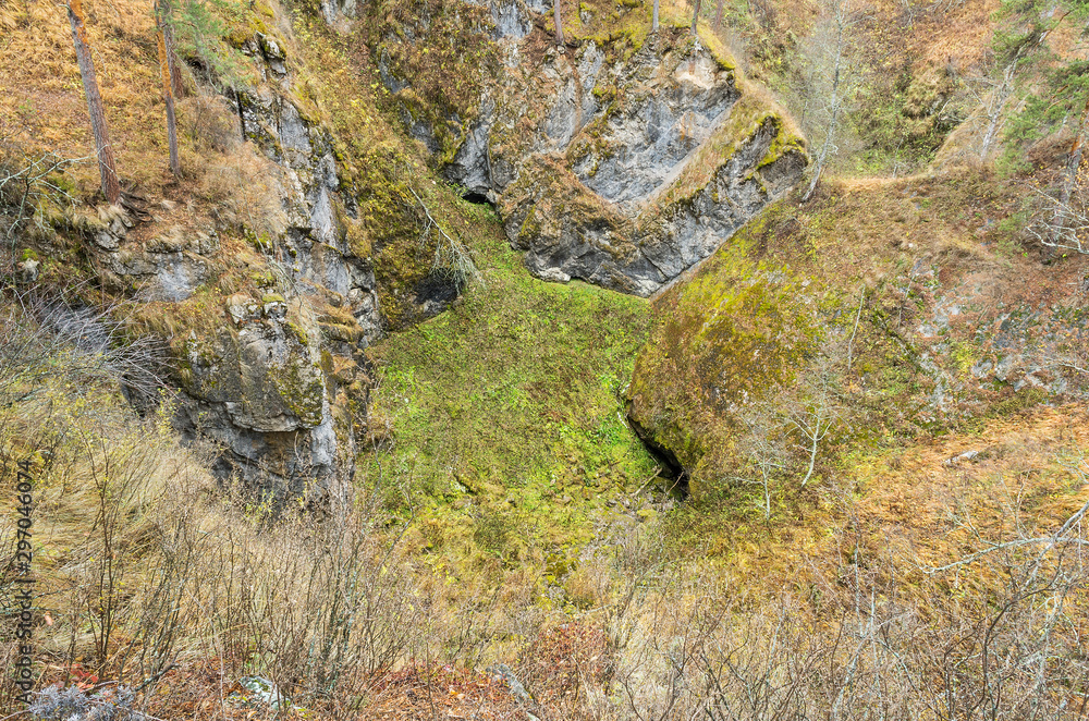 Karst bridge and entrance to karst cave.