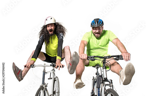 Two eccentric guys riding a bikes - team work © majdansky