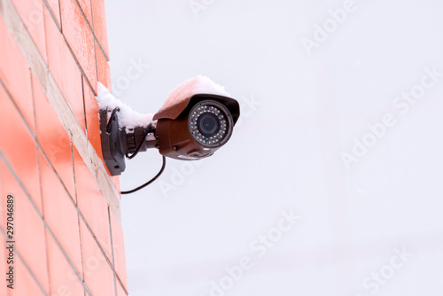 A camera mounted on the street on building for surveillance and security