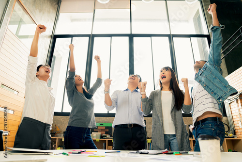 Konstfotografi successful startup new business teamwork group of business people hand up raise