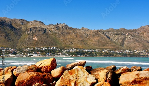 Landscape with Gordons Bay across the sea and the Overberg Mountains photo