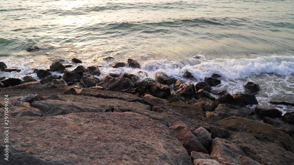 Rocky beach in uae . Waves splashing on rocks in sunny day . beach at the sunset , Waves crashing into the Rocks, WAVES HIT ON ROCKS, Waves roll on the stones of the beach, Rocky beach in uae . Waves splashing on rocks in sunny day . beach at the sunset , Waves crashing into the Rocks, WAVES HIT ON ROCKS, Waves roll on the stones of the beach,