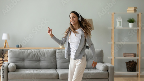 Billede på lærred Happy energetic young mixed race woman dancing.