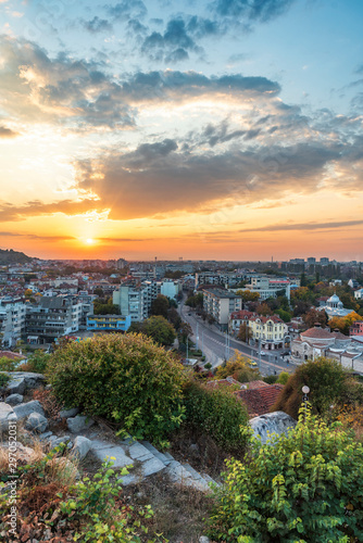 Fototapeta Naklejka Na Ścianę i Meble -  Autumn sunset over Plovdiv city, Bulgaria. European capital of culture 2019 and the oldest living city in Europe. Photo from one of the hills in the city.