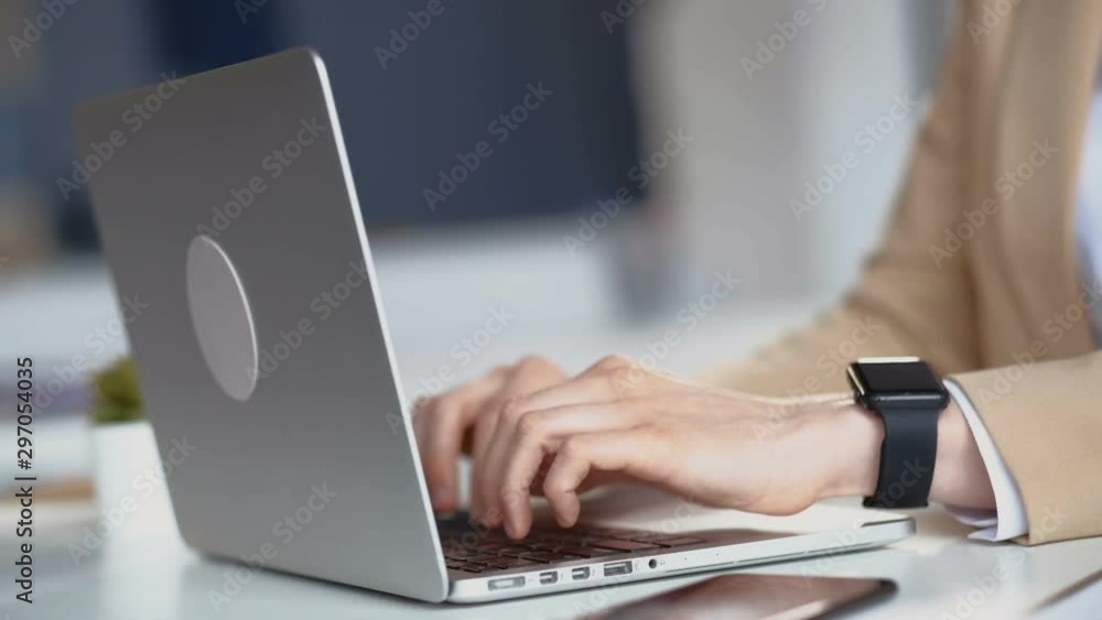 Female hands typing on laptop keyboard Female hands typing on laptop keyboard