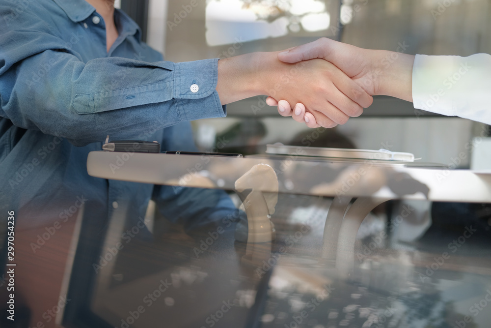 Business people shaking hands after meeting. colleagues handshaking. Greeting deal, teamwork partnership concept.