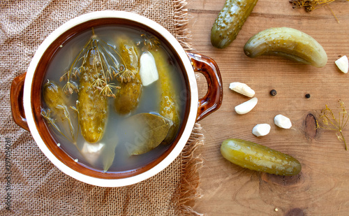 Slika na platnu Pickled cucumbers in a stoneware dish
