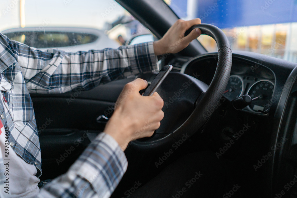 male driver in the vehicle using the smartphone, accident on the road male driver in the vehicle using the smartphone, accident on the road