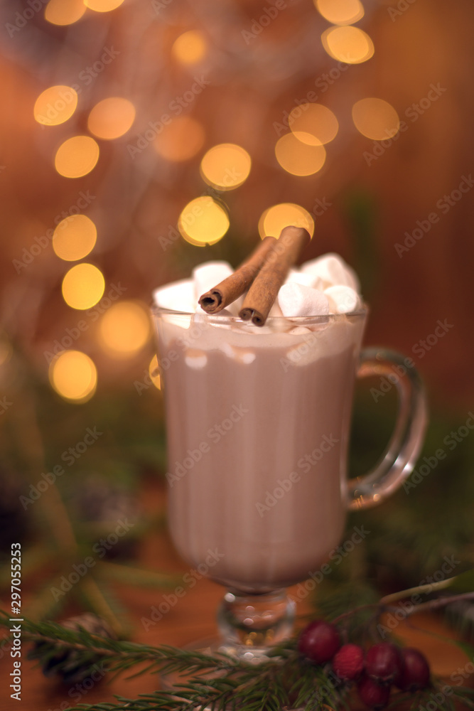 Cacao drink in a glass with marshmallow on the background of bokeh lights, hot Christmas drink Cacao drink in a glass with marshmallow on the background of bokeh lights, hot Christmas drink