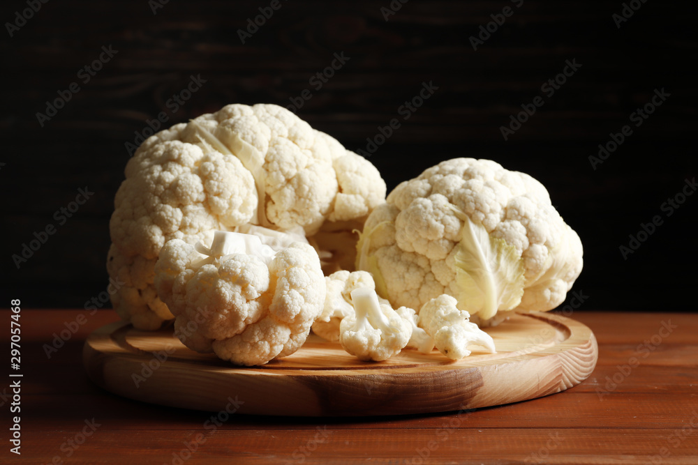 Fresh cauliflower on a brown wooden table Fresh cauliflower on a brown wooden table