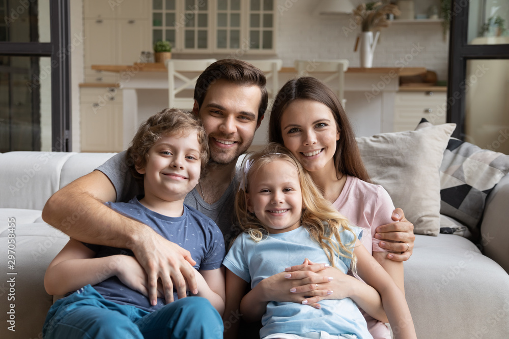 Head shot portrait happy family with two kids at home Head shot portrait happy family with two kids at home