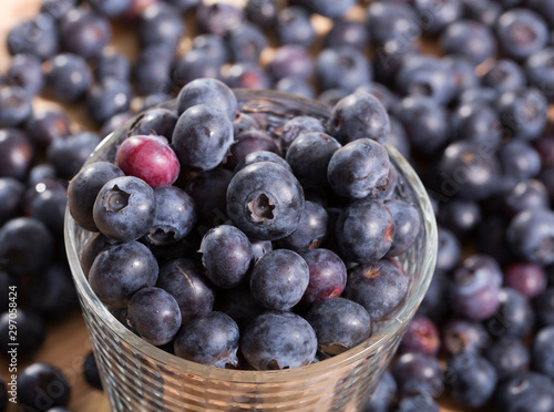 Juicy fresh blueberries on wooden table
